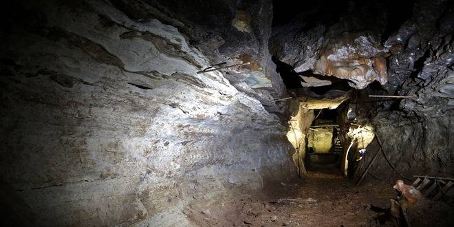 PLEASE HOLD FOR STORY SLUGGED HIDDEN CAVES BY JIM SALTER - In this photo made Thursday, April 14, 2016, a cave discovered in 1993 by Bass Pro Shops founder Johnny Morris is shown in Ridgedale, Mo. Morris believes the cave could be part of a larger unknown system after water from a sinkhole on his golf course about a half-mile away began flowing out the entrance. (AP Photo/Jeff Roberson)